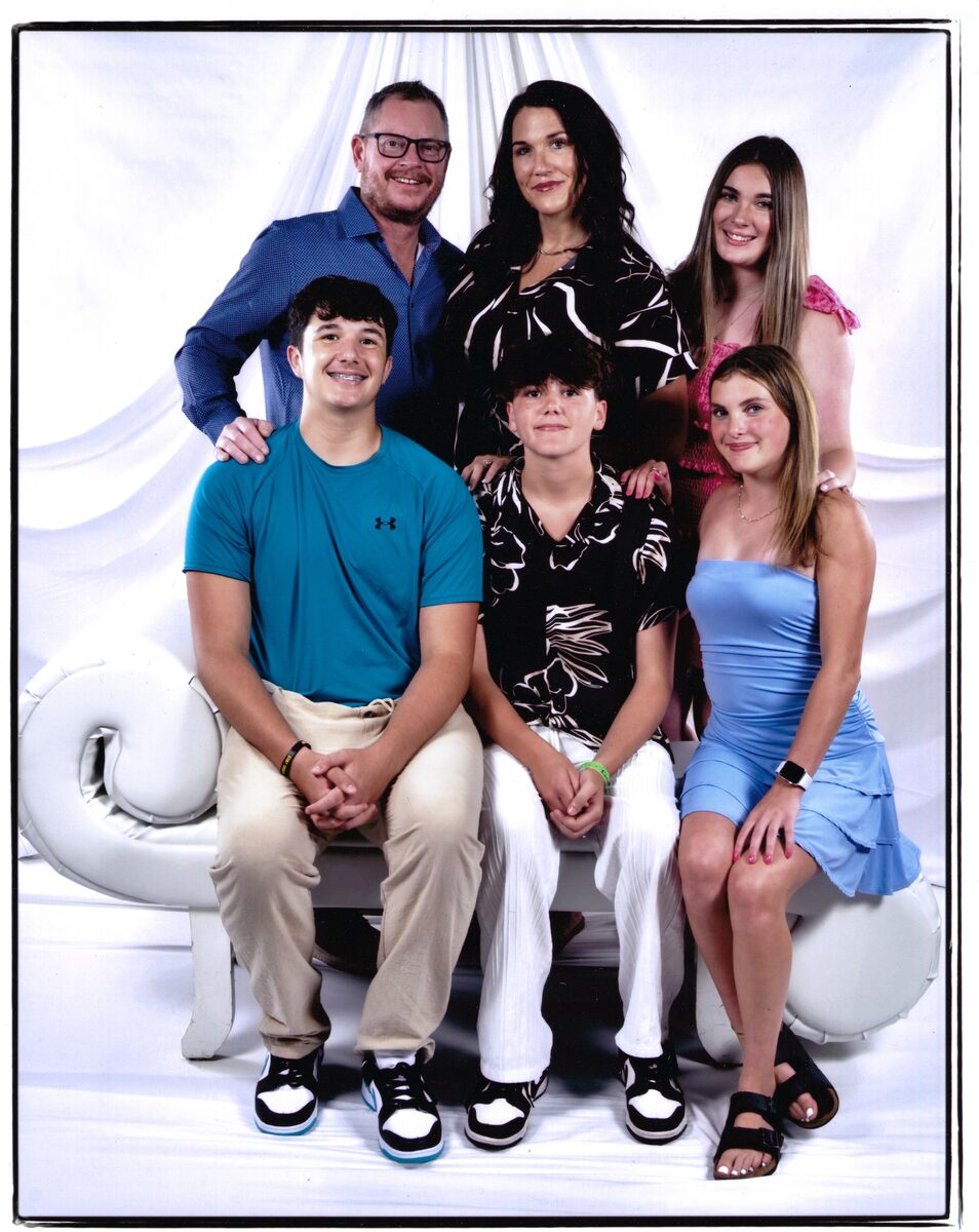 The LiveWire Electrical family — owner Jay Strickland and office manager Megan