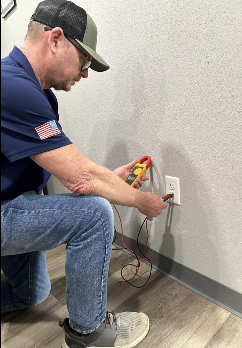 LiveWire electrician repairing an outlet