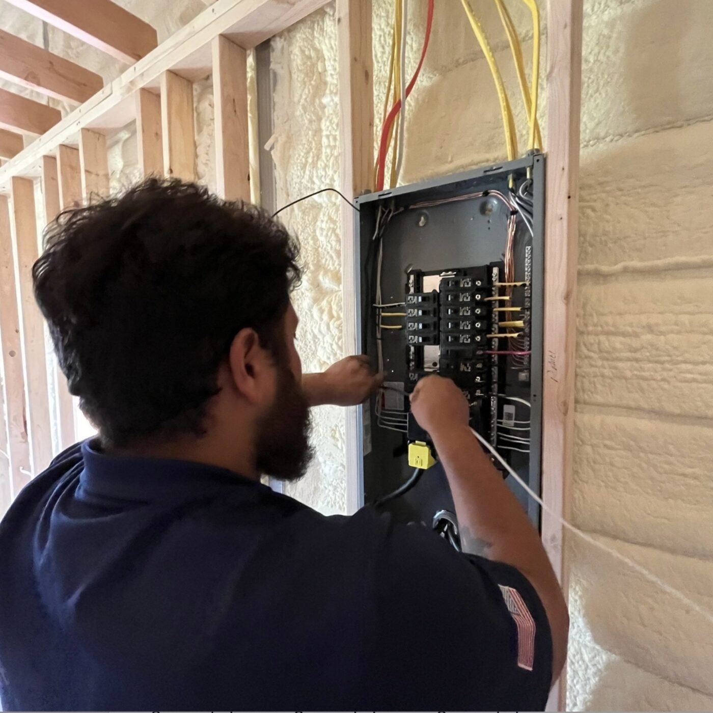 LiveWire electrician troubleshooting an electrical panel